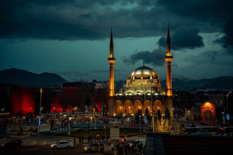 Illuminated Erciyes University Mosque at night in Kayseri, Turkey, showcasing stunning architecture.