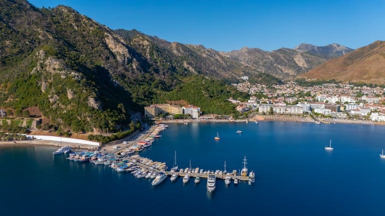 Stunning aerial view of Marmaris marina nestled between mountains and the sea.